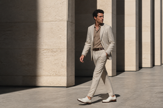 Man wearing the exact white Emilio Franco brogued leather Oxford in modern European architecture