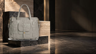 Dellamoda Victoria leather tote in a modern stone editorial setting