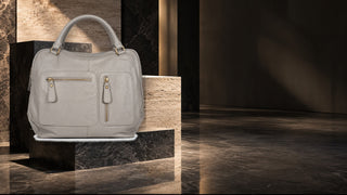 Dellamoda Charlotte leather satchel in a modern stone editorial setting
