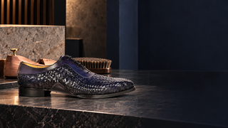 Mezlan S20702 navy woven leather Oxford in a modern shoecare atelier