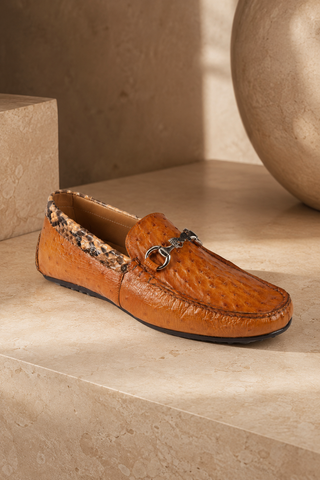 Elegant brown luxury Italian leather moccasins on a stone surface
