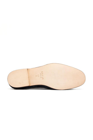 Bottom view of Zelli Italia navy suede penny loafer showing the smooth leather sole and size 9.5 M branding.