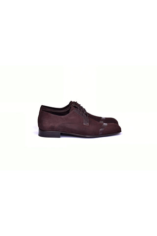 Brown suede and lizard skin cap-toe derby shoes with a leather sole.