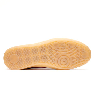 Gum rubber outsole of Zelli Italia Gotti white suede sneaker with textured geometric traction pattern.