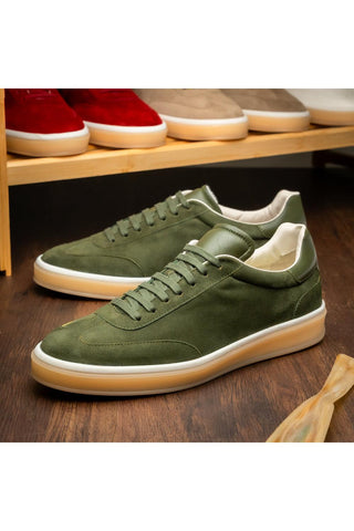 Zelli Italia Gotti olive suede and leather lace-up sneakers with a white rubber sole on a wooden surface.