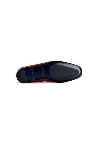 Bottom view of a tan Corrente Nappa leather loafer, size 42, featuring a dark blue sole with a textured grip.