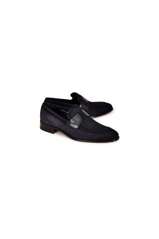 Corrente navy suede loafers with a textured Vita leather vamp and a sleek slip-on design on a leather sole.