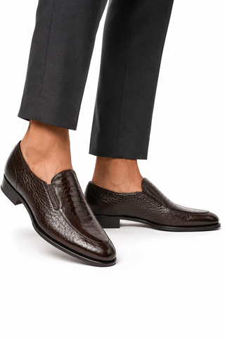 Dark brown Caporicci ostrich and peccary leather slip-on loafers with a low heel and Luigi rubber-inlaid sole.