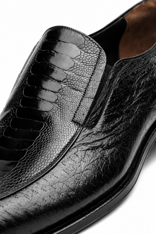 Black Caporicci slip-on loafer featuring textured ostrich skin and soft peccary leather panels.