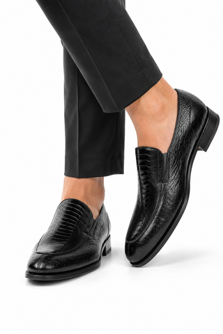 Black Caporicci ostrich and peccary leather slip-on loafers with a textured finish and Luigi rubber-leather sole.