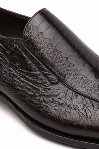 Dark brown Caporicci slip-on loafer featuring textured ostrich skin and soft peccary leather panels.