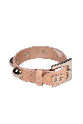 Peach python leather bracelet with silver studs and a DG logo buckle closure.