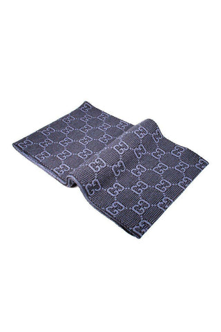 Navy blue Gucci wool scarf featuring a repeating GG logo pattern in a 9.4 by 71 inch rectangular design.