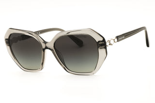 Swarovski SK6017 oversized women's sunglasses in translucent grey acetate with gradient lenses and decorative metal temples.