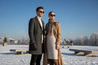 Image of a male and female model wearing sunglasses during a sunny and crisp winter day.